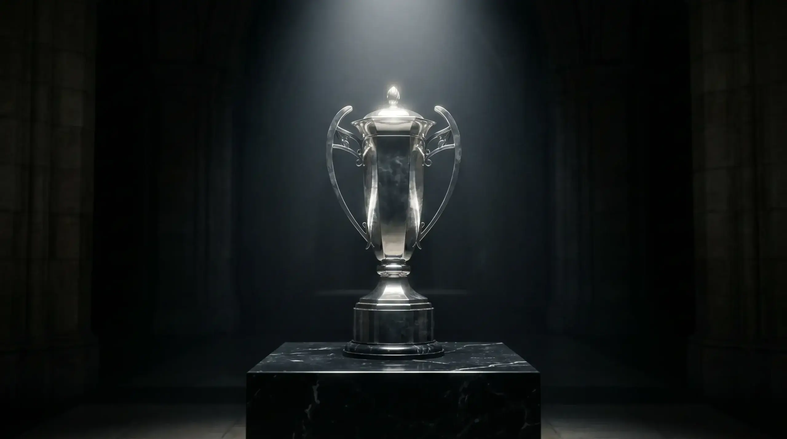 Rugby tournament trophy on a display plinth in a darkened hall